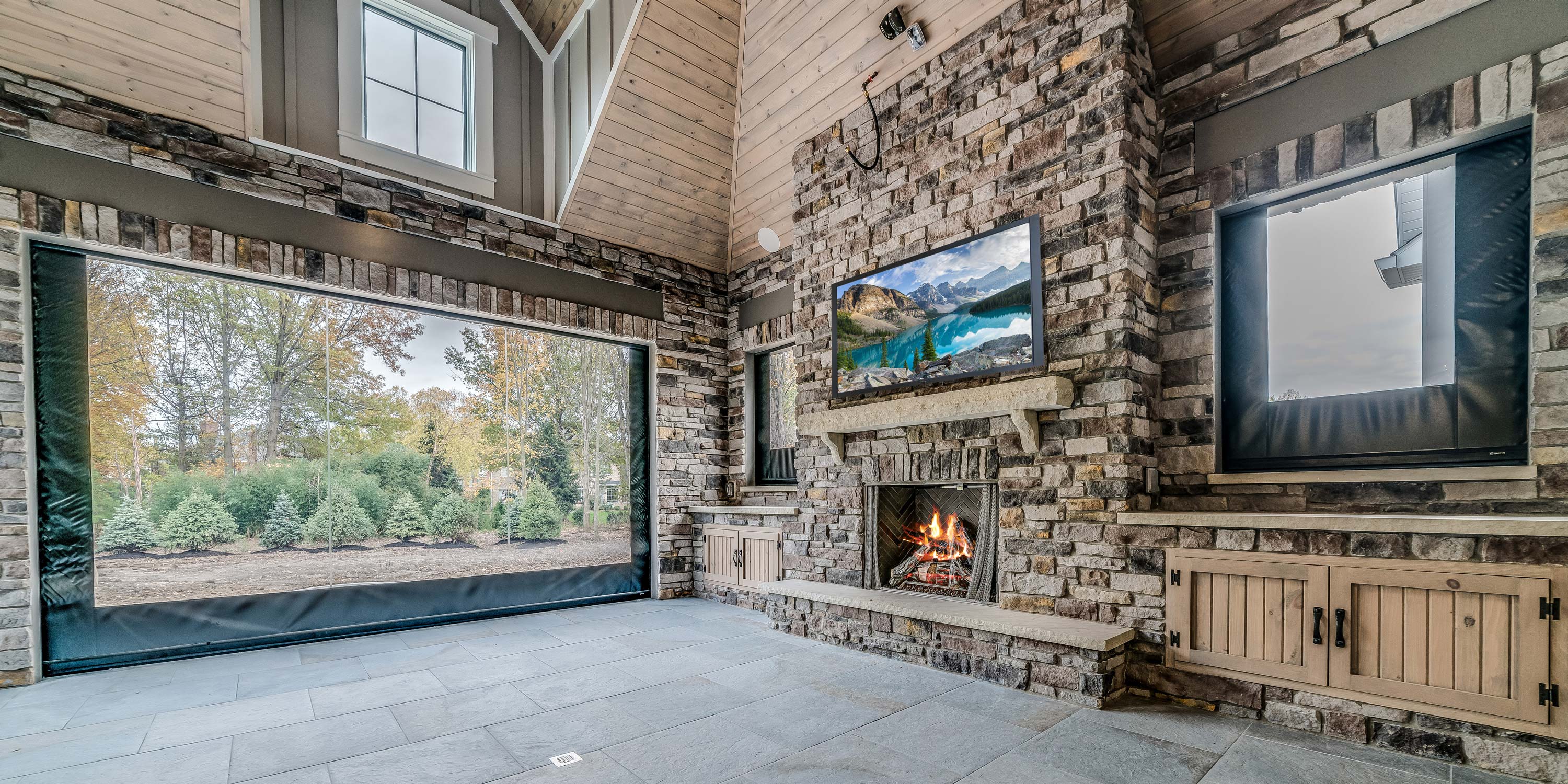 covered porch with wooden ceiling and green accents