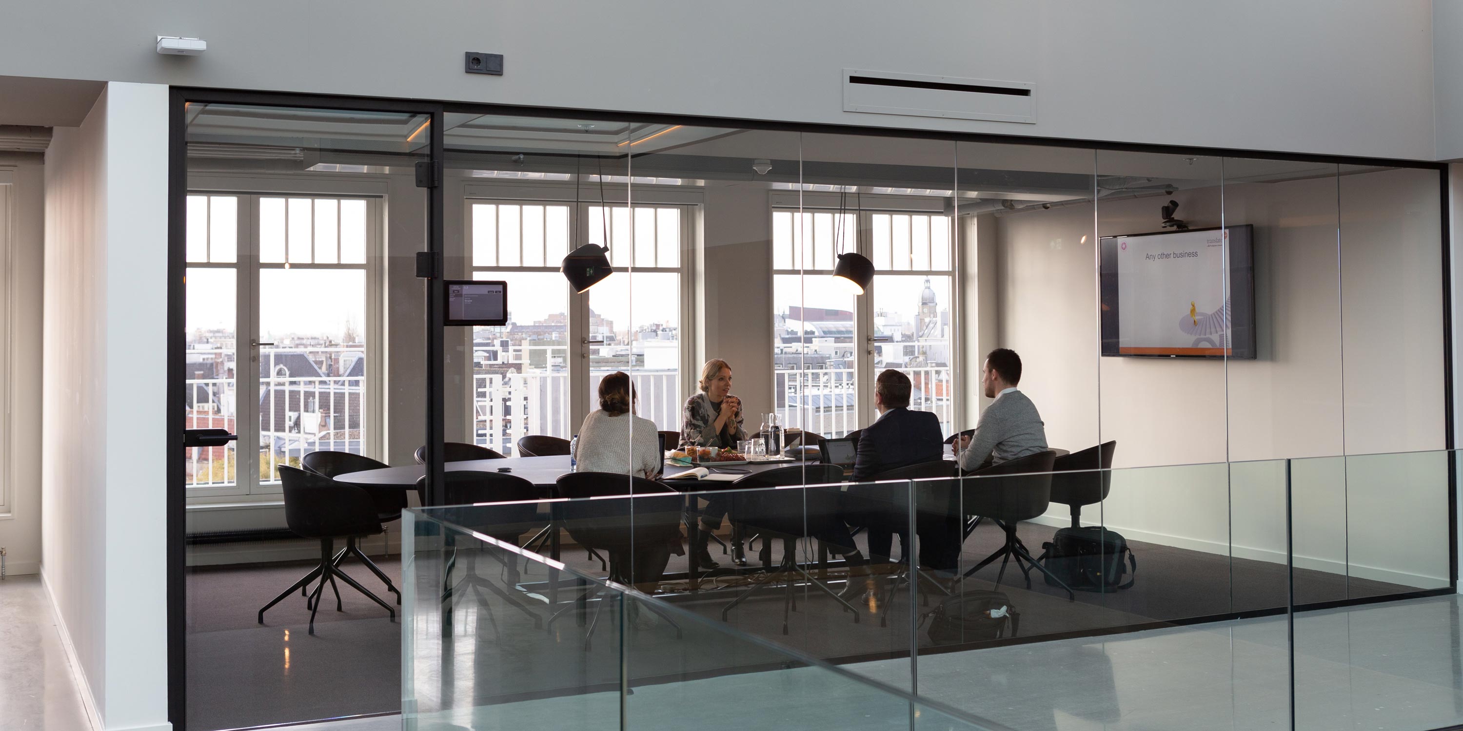 view of a team in a conference room with presentation technology
